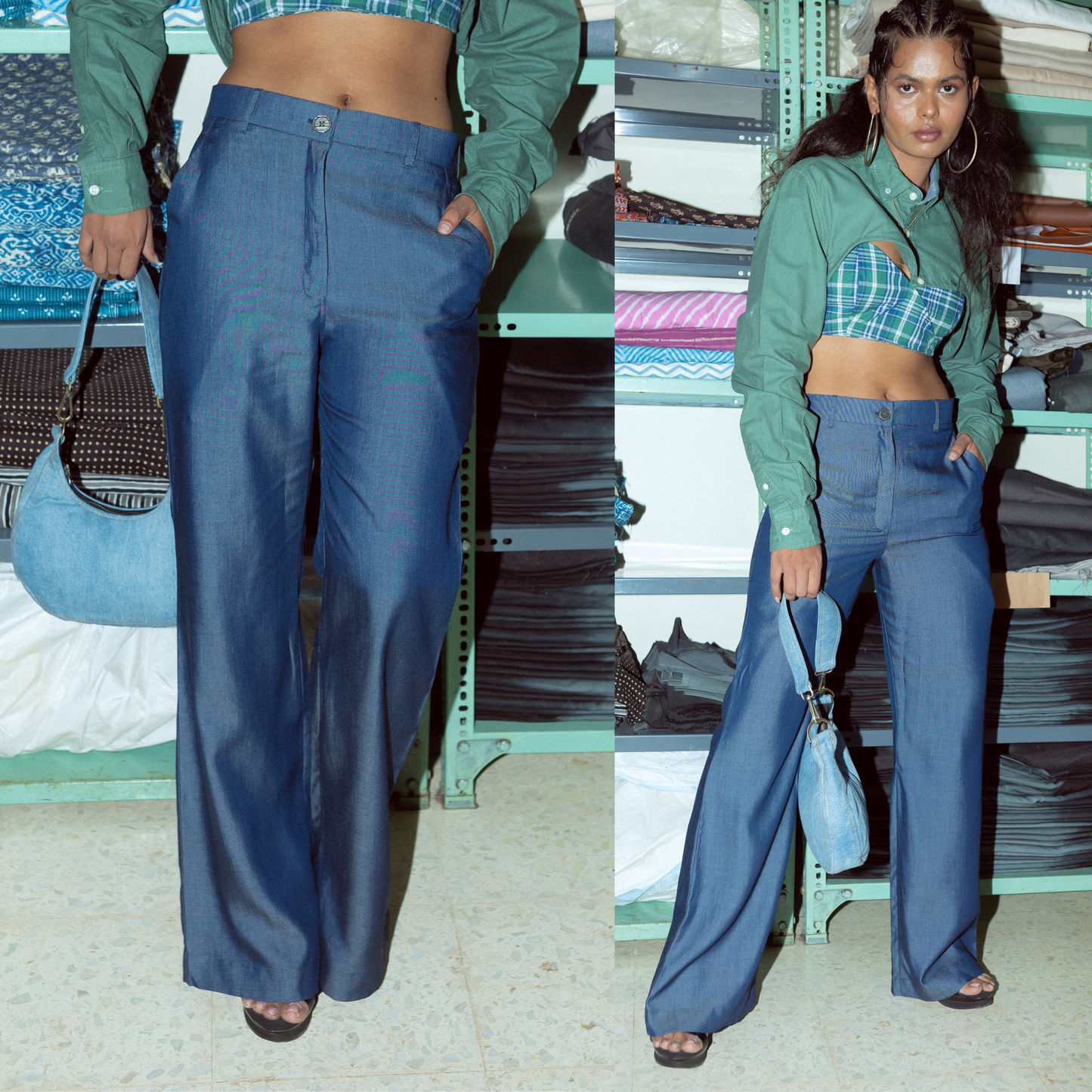 Woman wearing a green shirt and blue high-waisted pants with a light blue handbag.